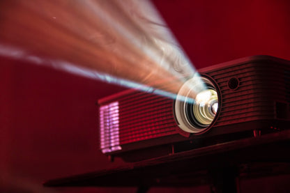 سما فيجن Smart 4K Projector cinematic light beams dark room
